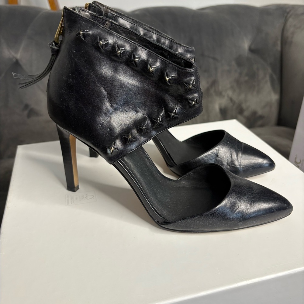Elliott Lucca studded stiletto pumps with an ankle cuff and rear zipper closure